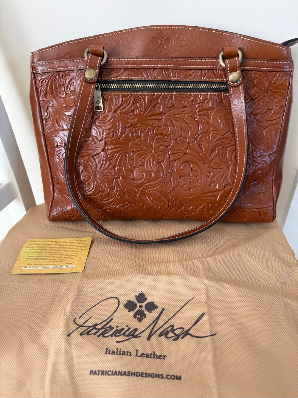 Patricia Nash Poppy Tote With Tooled Leather in Cognac With Dust Cover.